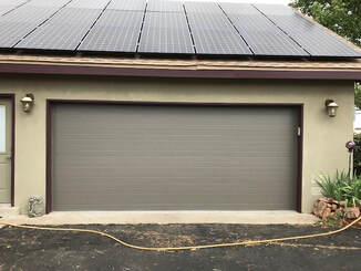 5 Reasons to Contact Your Local Garage Door Repair Expert - Plank Style Door with Bronze Finish