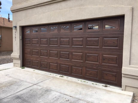 5 Reasons to Contact Your Local Garage Door Repair Expert - Short Raised Panel with Dark Oak Finish